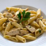 Savor Farfalle: Chicken and Roasted Garlic Delight Unveiled